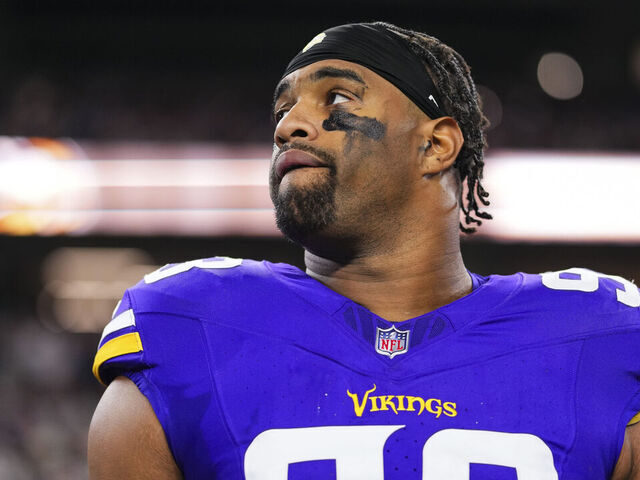 ARLINGTON, TX - DECEMBER 14: Jonathan Allen #93 of the Minnesota Vikings looks on from the sideline during the national anthem prior to an NFL football game against the Dallas Cowboys at AT&T Stadium on December 14, 2025 in Arlington, Texas.