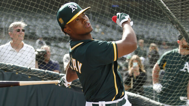 OAKLAND, CA - JUNE 15: First round draft pick Kyler Murray of the Oakland Athletics takes batting practice after signing his contract at the Oakland Alameda Coliseum on June 15, 2018 in Oakland, California.