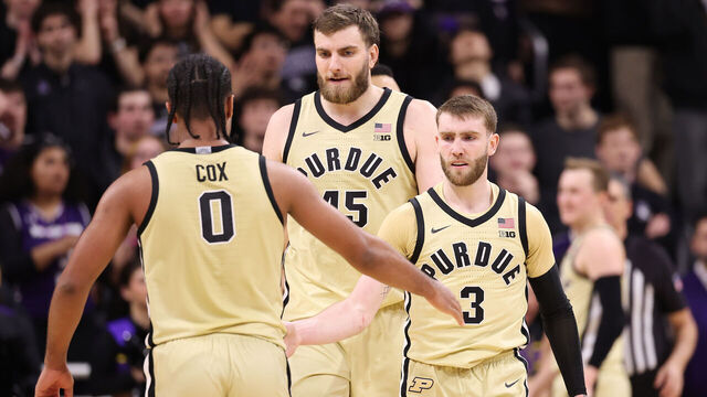 EVANSTON, ILLINOIS - MARCH 04: C.J. Cox #0, Oscar Cluff #45 and Braden Smith #3 of the Purdue Boilermakers celebrate against the Northwestern Wildcats during the second half at Welsh-Ryan Arena on March 04, 2026 in Evanston, Illinois.