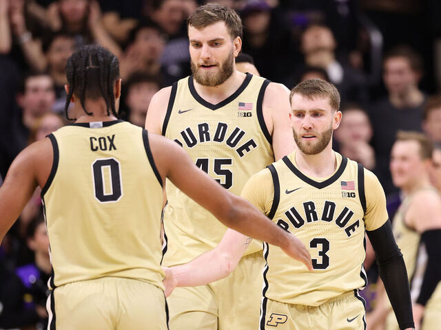 EVANSTON, ILLINOIS - MARCH 04: C.J. Cox #0, Oscar Cluff #45 and Braden Smith #3 of the Purdue Boilermakers celebrate against the Northwestern Wildcats during the second half at Welsh-Ryan Arena on March 04, 2026 in Evanston, Illinois.