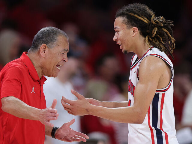 HOUSTON, TEXAS - MARCH 04: Head coach Kelvin Sampson of the Houston Cougars reacts with Kingston Flemings #4 of the Houston Cougars during the second half against the Baylor Bears at Fertitta Center on March 04, 2026 in Houston, Texas.