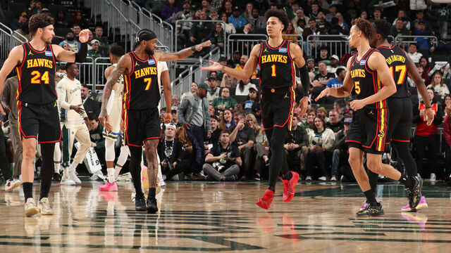 MILWAUKEE, WI - MARCH 4: Jalen Johnson #1, Nickeil Alexander-Walker #7, Corey Kispert #24, and Dyson Daniels #5 of the Atlanta Hawks high five during the game against the Milwaukee Bucks on March 4, 2026 at Fiserv Forum Center in Milwaukee, Wisconsin. Mandatory Copyright Notice: Copyright 2026 NBAE .
