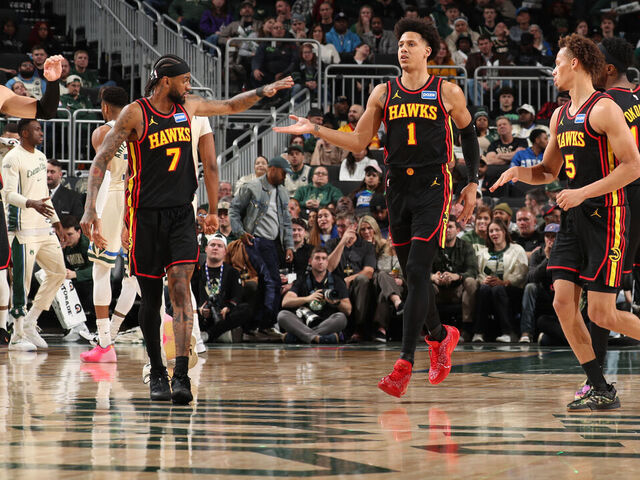 MILWAUKEE, WI - MARCH 4: Jalen Johnson #1, Nickeil Alexander-Walker #7, Corey Kispert #24, and Dyson Daniels #5 of the Atlanta Hawks high five during the game against the Milwaukee Bucks on March 4, 2026 at Fiserv Forum Center in Milwaukee, Wisconsin. Mandatory Copyright Notice: Copyright 2026 NBAE .