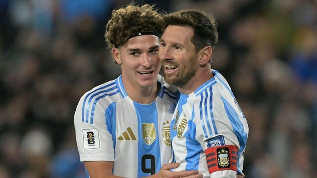 Argentina's forward #10 Lionel Messi celebrates after scoring his second goal with forward #09 Julian Alvarez during the 2026 FIFA World Cup South American qualifiers football match between Argentina and Venezuela at the Mas Monumental stadium in Buenos Aires on September 4, 2025.