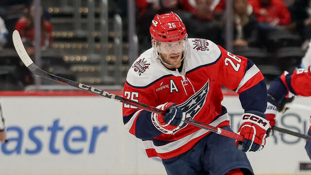 WASHINGTON, DC - MARCH 3: Nic Dowd #26 of the Washington Capitals races for a loose puck during a game against the Utah Mammoth at Capital One Arena on March 3, 2026 in Washington, D.C.