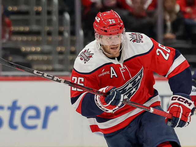 WASHINGTON, DC - MARCH 3: Nic Dowd #26 of the Washington Capitals races for a loose puck during a game against the Utah Mammoth at Capital One Arena on March 3, 2026 in Washington, D.C.