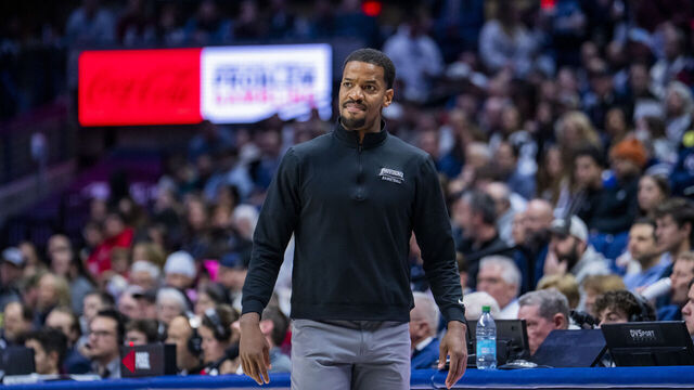 STORRS, CONNECTICUT - JANUARY 27: Providence Friars head coach Kim English coaches his team against the Connecticut Huskies during the first half of an NCAA men's basketball game at Harry A. Gampel Pavilion on January 27, 2026 in Storrs, Connecticut.