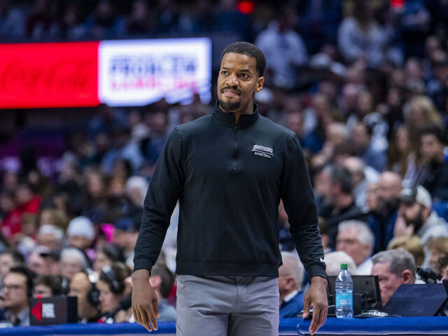 STORRS, CONNECTICUT - JANUARY 27: Providence Friars head coach Kim English coaches his team against the Connecticut Huskies during the first half of an NCAA men's basketball game at Harry A. Gampel Pavilion on January 27, 2026 in Storrs, Connecticut.