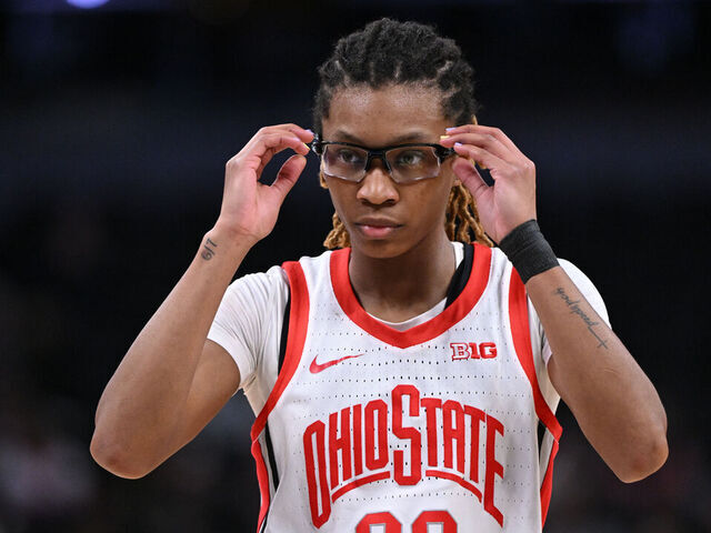 INDIANAPOLIS, INDIANA - MARCH 5: Jaloni Cambridge #22 of the Ohio State Buckeyes adjusts their goggles during the second round of the Big Ten Women's Basketball Tournament at Gainbridge Fieldhouse on March 5, 2026 in Indianapolis, Indiana.