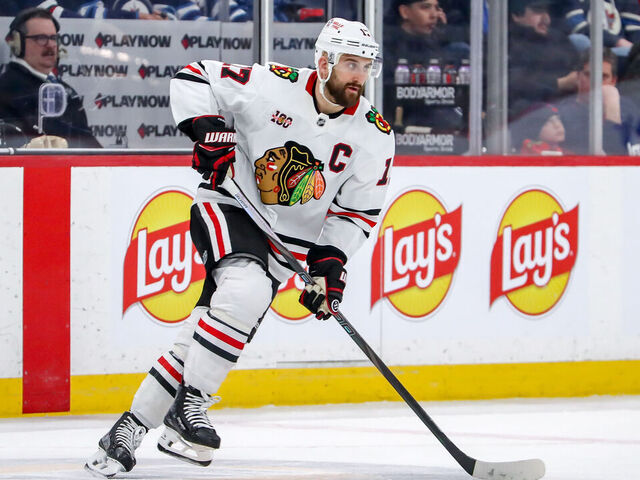 WINNIPEG, CANADA - MARCH 3: Nick Foligno #17 of the Chicago Blackhawks plays the puck up the ice during second period action against the Winnipeg Jets at the Canada Life Centre on March 3, 2026 in Winnipeg, Manitoba, Canada. The Jets defeated the Hawks 3-2 in overtime.