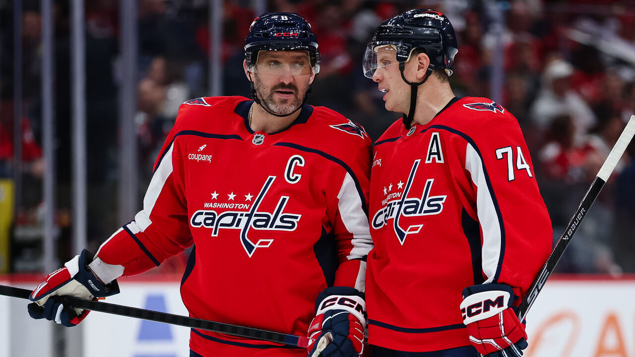 WASHINGTON, DC - OCTOBER 31: Alex Ovechkin #8 of the Washington Capitals speaks with John Carlson #74 during the second period of the game against the New York Islanders at Capital One Arena on October 31, 2025 in Washington, DC.
