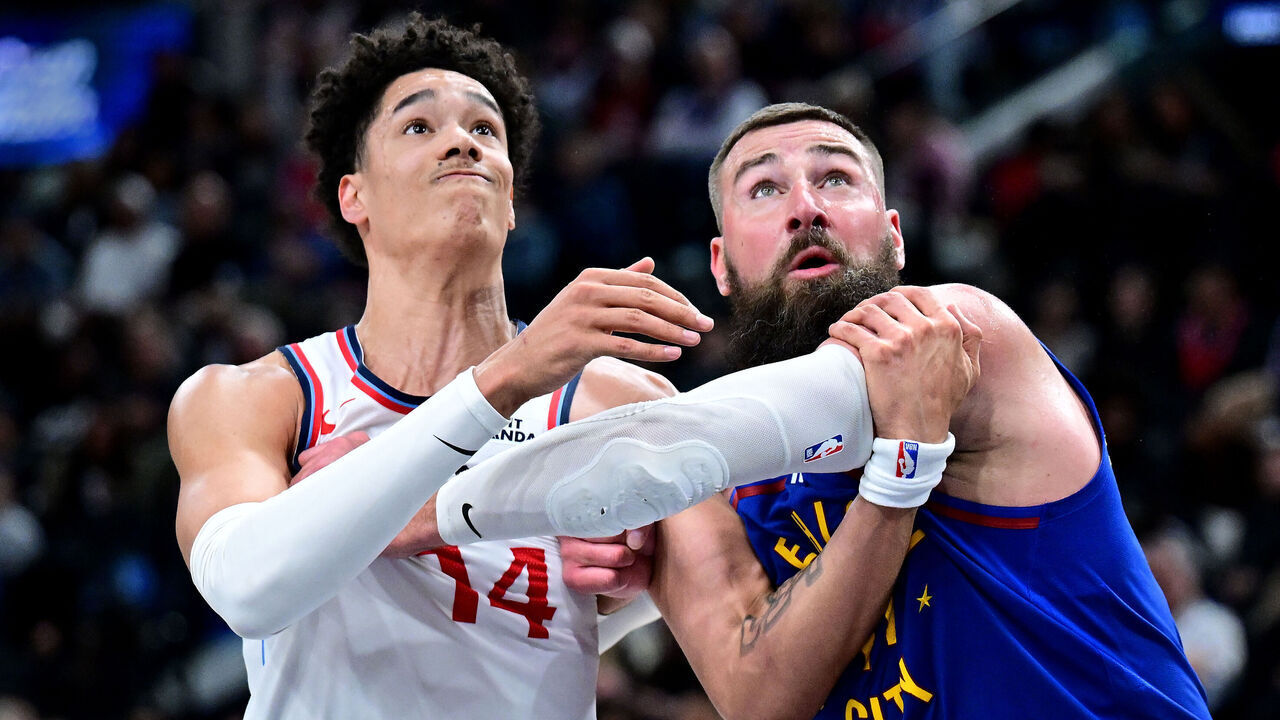 INGLEWOOD, CALIFORNIA - FEBRUARY 19: Yanic Konan Niederhauser #14 of the Los Angeles Clippers and Jonas Valanciunas #17 of the Denver Nuggets battle for position under the basket in the second half at Intuit Dome on February 19, 2026 in Inglewood, California.