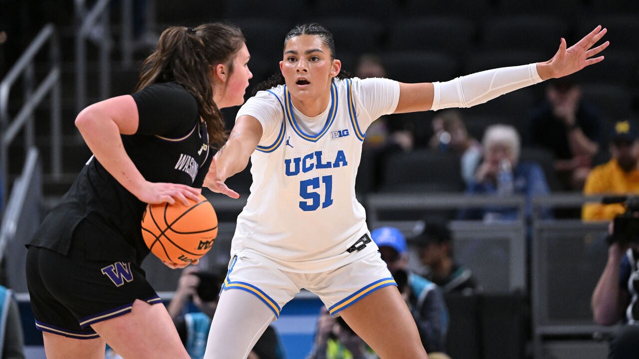 INDIANAPOLIS, INDIANA - MARCH 6: Lauren Betts #51 of the UCLA Bruins guards Brynn McGaughy #21 of the Washington Huskies at Gainbridge Fieldhouse on March 6, 2025 in Indianapolis, Indiana.
