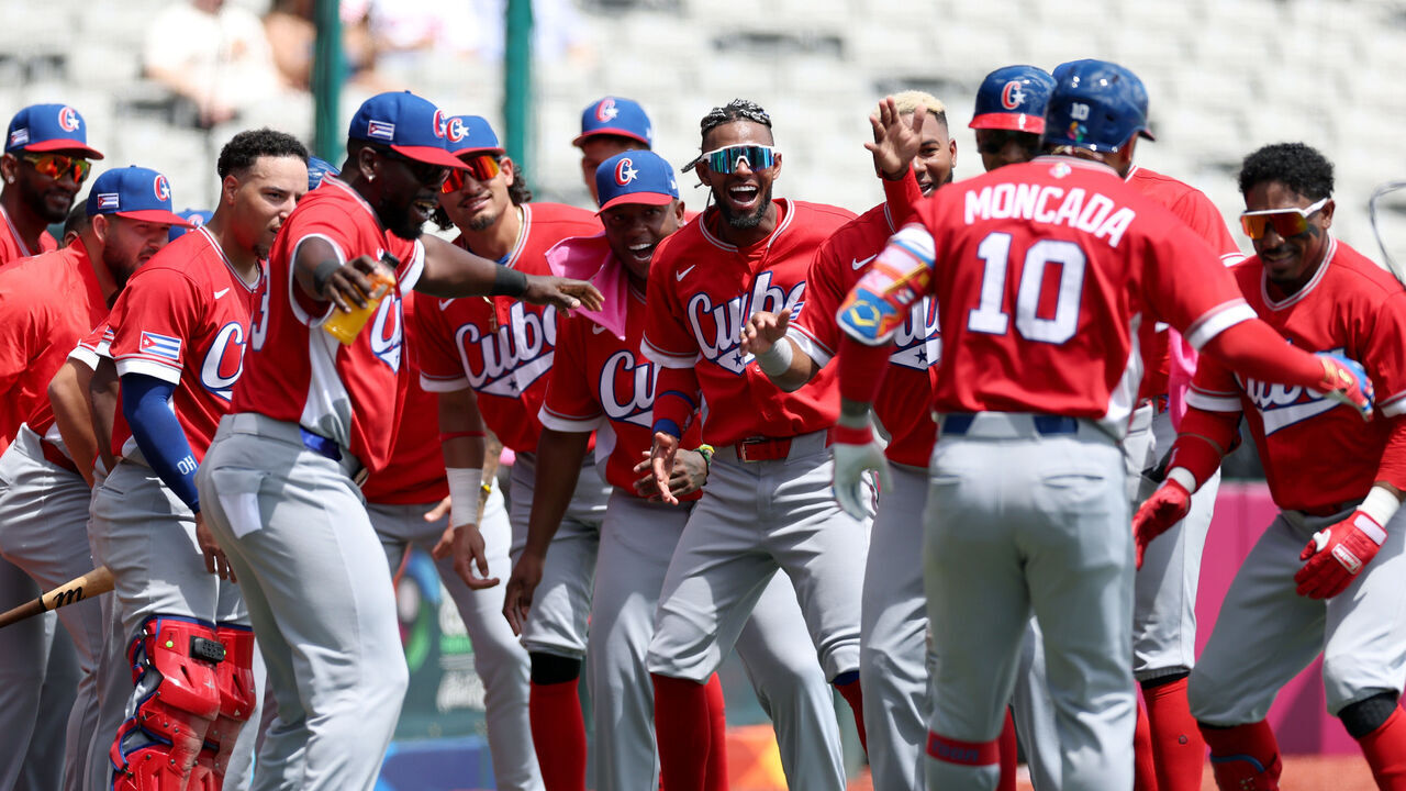SAN JUAN, PUERTO RICO - MARCH 06: Yoán Moncada #10 of the Team Cuba celebrates with teammates after hitting a two-run home run against the Team Panama during the third inning at Hiram Bithorn Stadium on March 06, 2026 in San Juan, Puerto Rico.