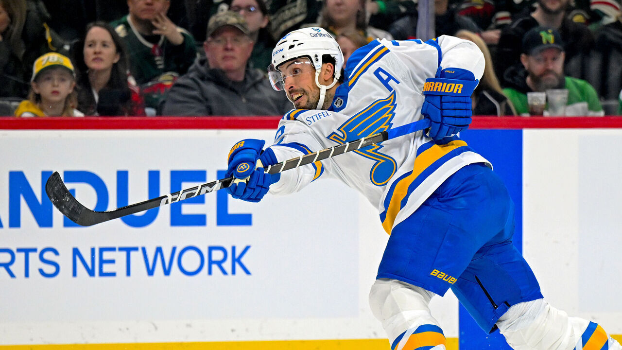 SAINT PAUL, MN - MARCH 01: St. Louis Blues defensemen Justin Faulk (72) shoots the puck during the first period of a NHL game between the Minnesota Wild and St. Louis Blues on March 1, 2026, at Grand Casino Arena in Saint Paul, MN.