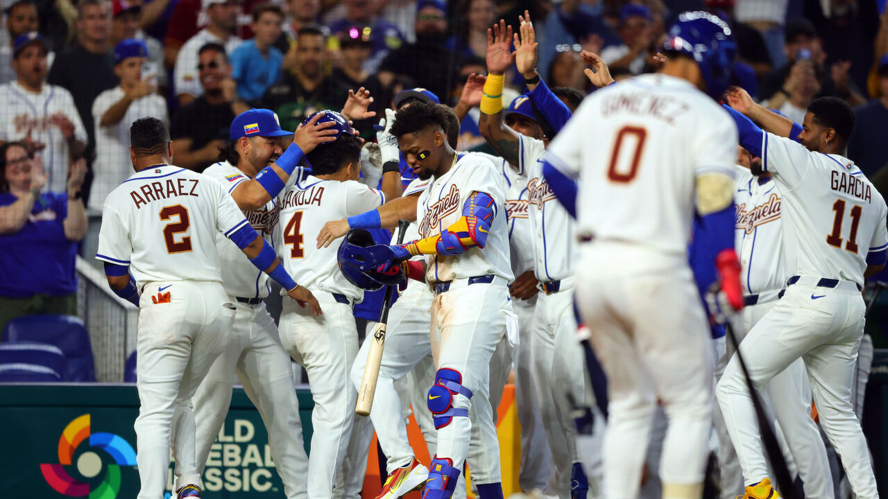 MIAMI, FL - MARCH 06: Javier Sanoja #4 of Team Venezuela celebrates with teammates after hitting a home run in the second inning during the 2026 World Baseball Classic Pool D game presented by Capital One between Team Netherlands and Team Venezuela at loanDepot park on Friday, March 6, 2026 in Miami, Florida.