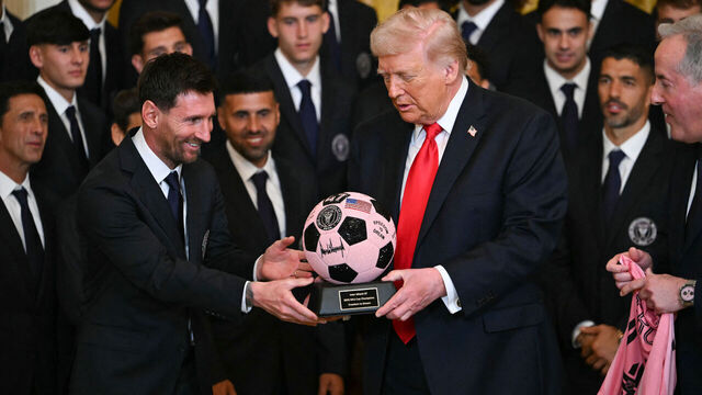 Argntinian star Lionel Messi hands US President Donald Trump a ball during an event for Inter Miami CF, winners of the 2025 Major League Soccer Cup, in the East Room of the White House in Washington, DC, on March 5, 2026.