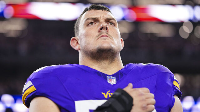 ARLINGTON, TX - DECEMBER 14: Ryan Kelly #78 of the Minnesota Vikings looks on from the sideline during the national anthem prior to an NFL football game against the Dallas Cowboys at AT&T Stadium on December 14, 2025 in Arlington, Texas.