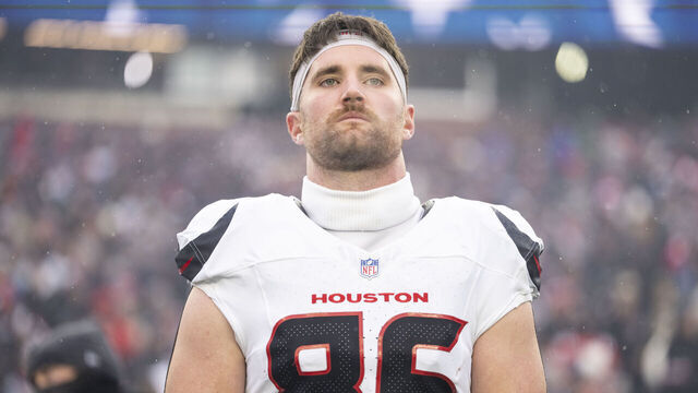 FOXBOROUGH, MASSACHUSETTS - JANUARY 18: Dalton Schultz #86 of the Houston Texans looks on during the national anthem prior to an NFC Divisional Playoff game against the New England Patriots at Gillette Stadium on January 18, 2026 in Foxborough, Massachusetts.