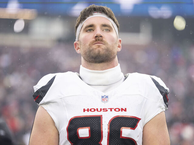 FOXBOROUGH, MASSACHUSETTS - JANUARY 18: Dalton Schultz #86 of the Houston Texans looks on during the national anthem prior to an NFC Divisional Playoff game against the New England Patriots at Gillette Stadium on January 18, 2026 in Foxborough, Massachusetts.