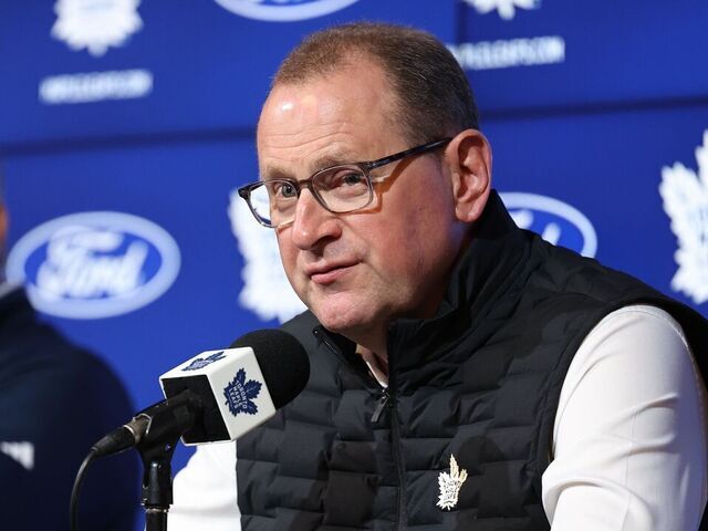 TORONTO, ON - September 17 Leafs General Manager Brad Treliving chats to the media with Head Coach Craig Berube to the left. The Toronto Maple Leafs held a media availability prior to to their first skate of the season tomorrow at their practice facility at the Ford Performance Centre. September 17 2025 Richard Lautens/Toronto Star