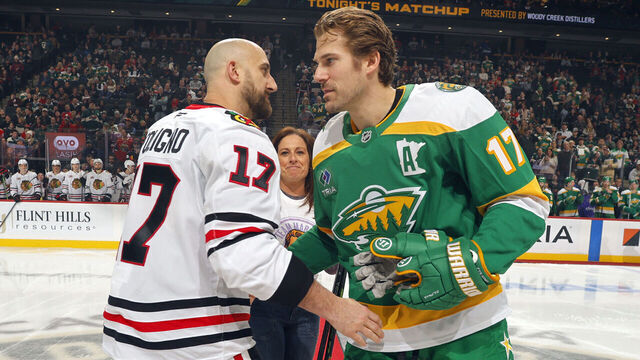 SAINT PAUL, MN - JANUARY 27: Marney Gellnar takes part in the ceremonial puck drop with Marcus Foligno #17 of the Minnesota Wild and Nick Foligno #17 of the Chicago Blackhawks prior to the game at Grand Casino Arena on January 27, 2026 in Saint Paul, Minnesota.