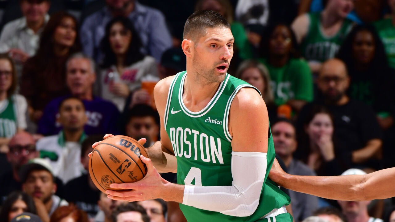 PHOENIX, AZ - FEBRUARY 24: Nikola Vuevi #4 of the Boston Celtics handles the ball during the game against the Phoenix Suns on February 24, 2026 at PHX Arena in Phoenix, Arizona. Mandatory Copyright Notice: Copyright 2026 NBAE