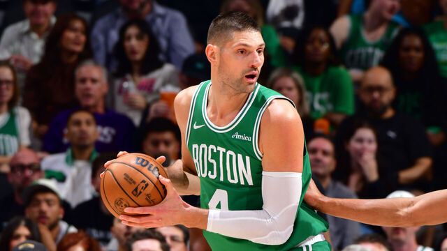 PHOENIX, AZ - FEBRUARY 24: Nikola Vuevi #4 of the Boston Celtics handles the ball during the game against the Phoenix Suns on February 24, 2026 at PHX Arena in Phoenix, Arizona. Mandatory Copyright Notice: Copyright 2026 NBAE