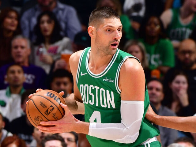 PHOENIX, AZ - FEBRUARY 24: Nikola Vuevi #4 of the Boston Celtics handles the ball during the game against the Phoenix Suns on February 24, 2026 at PHX Arena in Phoenix, Arizona. Mandatory Copyright Notice: Copyright 2026 NBAE