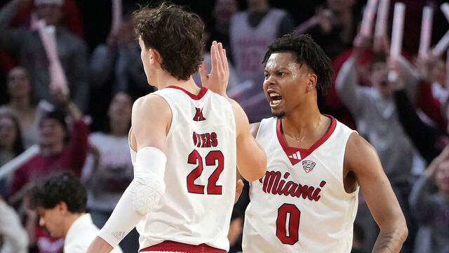 OXFORD, OHIO - JANUARY 27: Brant Byers #22 and Eian Elmer #0 of the Miami (OH) RedHawks celebrate in the second half against the UMass Minutemen at Millett Hall on January 27, 2026 in Oxford, Ohio.