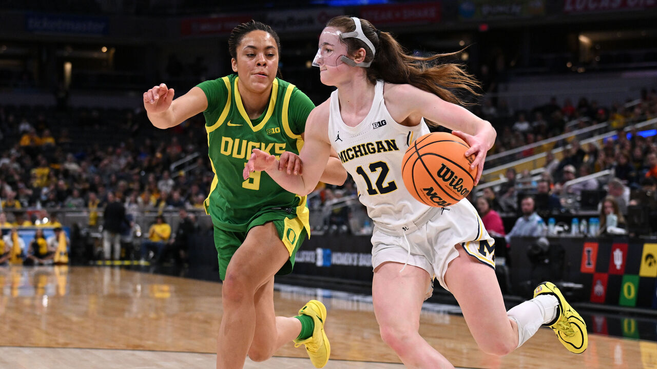 INDIANAPOLIS, INDIANA - MARCH 6: Syla Swords #12 of the Michigan Wolverines drives around Sofia Bell #3 of the Oregon Ducks during a game in the 2026 Big Ten women’s basketball tournament at Gainbridge Fieldhouse on March 6, 2026 in Indianapolis, Indiana.
