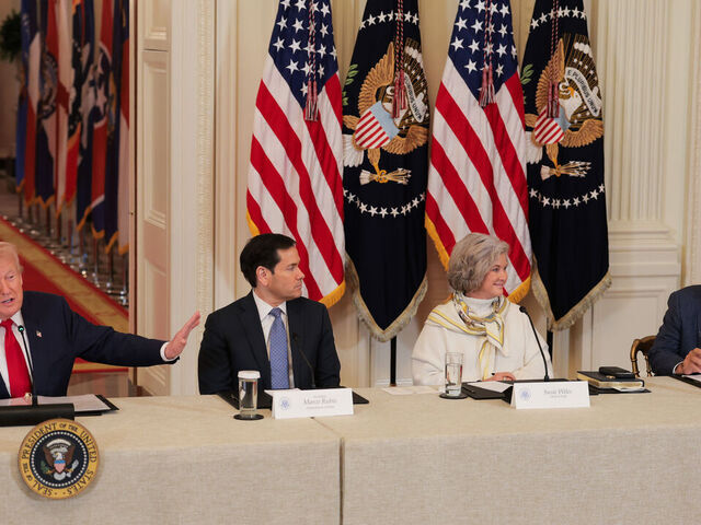 WASHINGTON, DC - MARCH 06: U.S. President Donald Trump (L) gestures as former head coach Nick Saban (R) speaks alongside U.S. Secretary of State Marco Rubio and White House Chief of Staff Susie Wiles during a roundtable discussion on college sports in the East Room of the White House on March 06, 2026 in Washington, DC. The Trump administration held the roundtable titled "Saving College Sports" with leaders from the Power Four conferences, media executives and former coaches.
