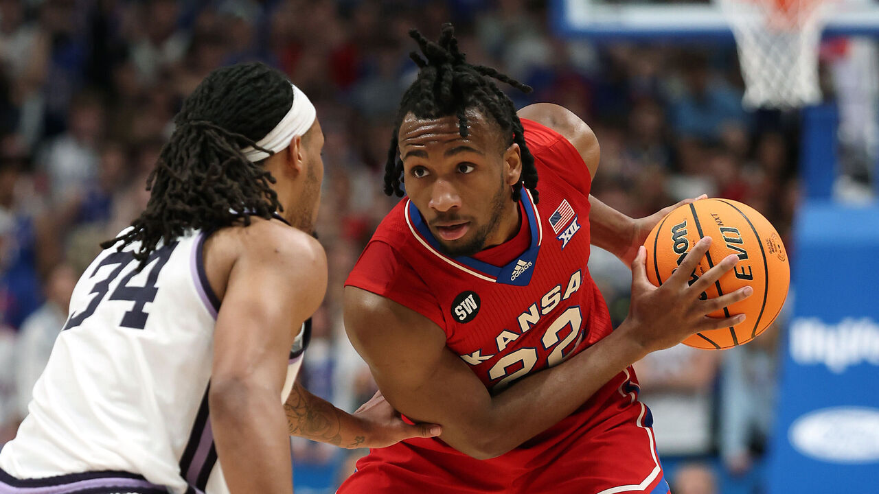 LAWRENCE, KANSAS - MARCH 07: Darryn Peterson #22 of the Kansas Jayhawks controls the ball during the game against the Kansas State Wildcats at Allen Fieldhouse on March 07, 2026 in Lawrence, Kansas.