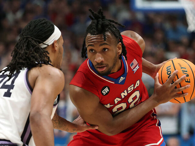 LAWRENCE, KANSAS - MARCH 07: Darryn Peterson #22 of the Kansas Jayhawks controls the ball during the game against the Kansas State Wildcats at Allen Fieldhouse on March 07, 2026 in Lawrence, Kansas.