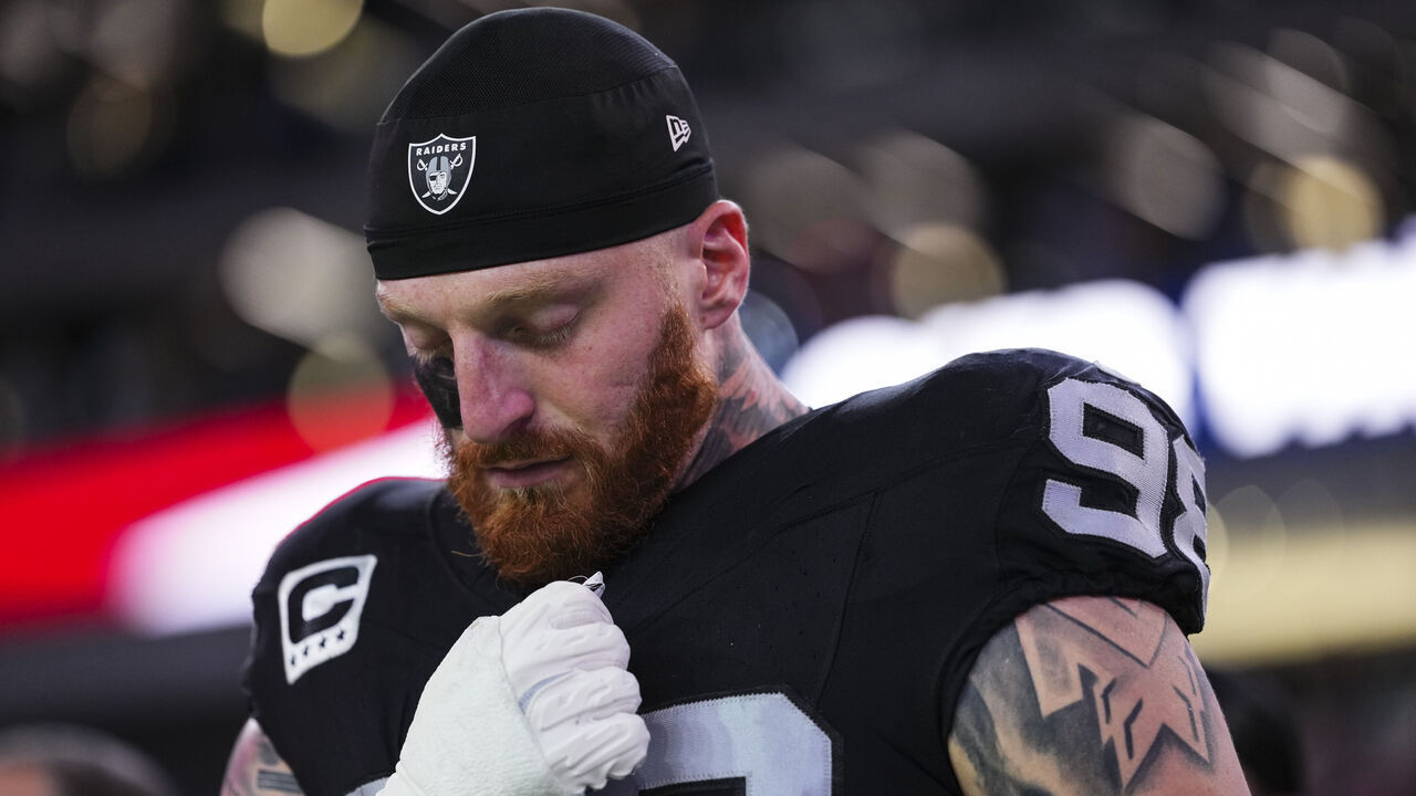 LAS VEGAS, NV - NOVEMBER 17: Maxx Crosby #98 of the Las Vegas Raiders looks on from the sideline during the national anthem prior to an NFL football game against the Dallas Cowboys at Allegiant Stadium on November 17, 2025 in Las Vegas, Nevada.