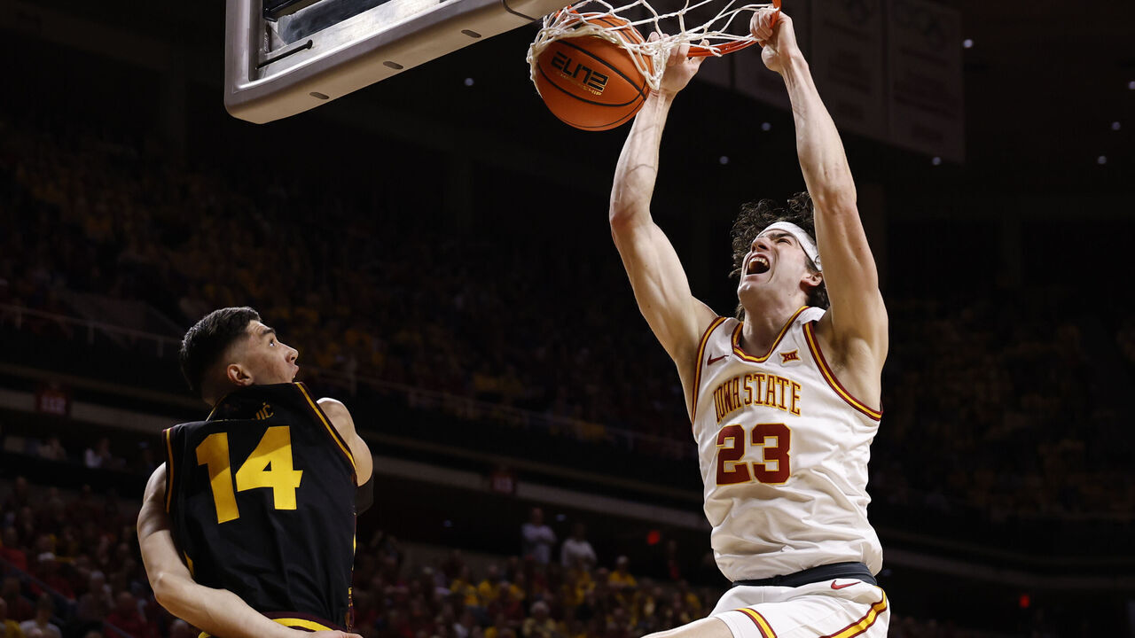 AMES, IA - MARCH 7: Blake Buchanan #23 of the Iowa State Cyclones dunks the ball as Andrija Grbovic #14 of the Arizona State Sun Devils defends in the first half of play at Hilton Coliseum on March 7, 2026 in Ames, Iowa.