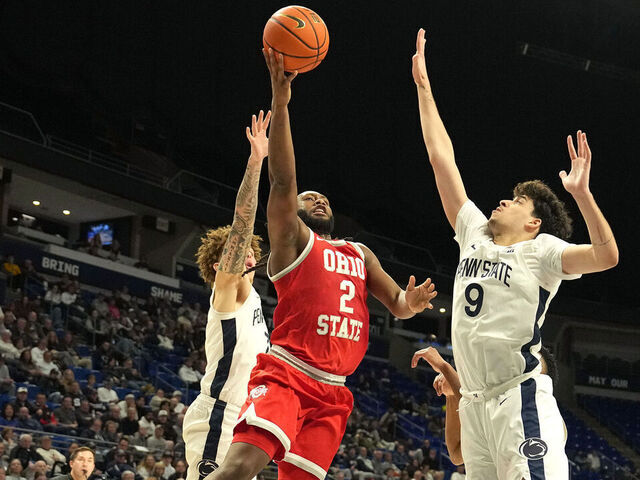 UNIVERSITY, PA- MARCH 04: Bruce Thornton #2 of the Ohio State Buckeyes dries tho the basket between Dominick Stewart #7 and Melih Tunca #9 of the Penn State Nittany Lions in the first half during a college basketball game at the Bryce Jordan Center on March 4, 2026 in University Park, Pennsylvania.