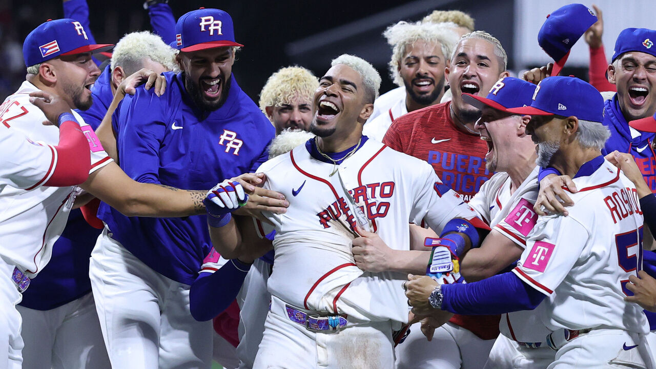 SAN JUAN, PUERTO RICO - MARCH 07: Darell Hernaiz #23 of Team Puerto Rico celebrates with teammates after hitting a walk-off solo home run against Team Panama during the tenth inning at Hiram Bithorn Stadium on March 07, 2026 in San Juan, Puerto Rico.