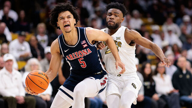 BOULDER, COLORADO - MARCH 07: Brayden Burries #5 of the Arizona Wildcats drives to the basket against Barrington Hargress #24 of the Colorado Buffaloes during the second half at the CU Events Center on March 07, 2026 in Boulder, Colorado.