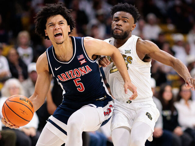 BOULDER, COLORADO - MARCH 07: Brayden Burries #5 of the Arizona Wildcats drives to the basket against Barrington Hargress #24 of the Colorado Buffaloes during the second half at the CU Events Center on March 07, 2026 in Boulder, Colorado.