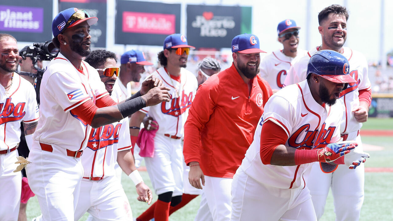 SAN JUAN, PUERTO RICO - MARCH 08: Erisbel Arruebarrena #71 of Team Cuba celebrates with teammates after hitting a solo home run against Team Colombia in the first inning during the 2026 World Baseball Classic at Hiram Bithorn Stadium on March 08, 2026 in San Juan, Puerto Rico.