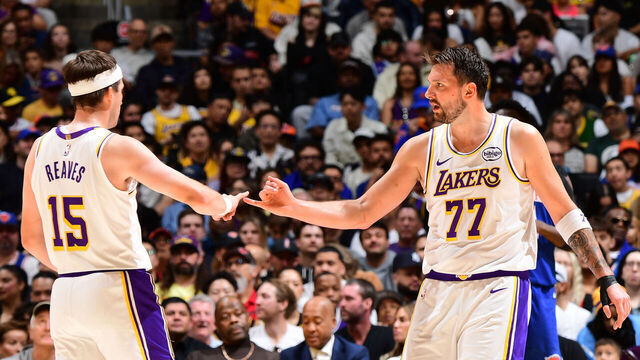 LOS ANGELES, CA - MARCH 8: Austin Reaves #15 and Luka Doncic #77 of the Los Angeles Lakers high five during the game against the New York Knicks on March 8, 2026 at Crypto.Com Arena in Los Angeles, California. NOTE TO USER: User expressly acknowledges and agrees that, by downloading and/or using this Photograph, user is consenting to the terms and conditions of the Getty Images License Agreement. Mandatory Copyright Notice: Copyright 2026 NBAE
