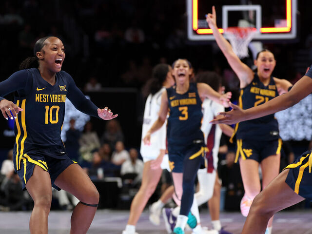 KANSAS CITY, MISSOURI - MARCH 08: Jordan Harrison #10 of the West Virginia Mountaineers celebrates with teammates after the Mountaineers defeated the TCU Horned Frogs to win the championship game of the 2026 Big 12 Women's Tournament at T-Mobile Center on March 08, 2026 in Kansas City, Missouri.