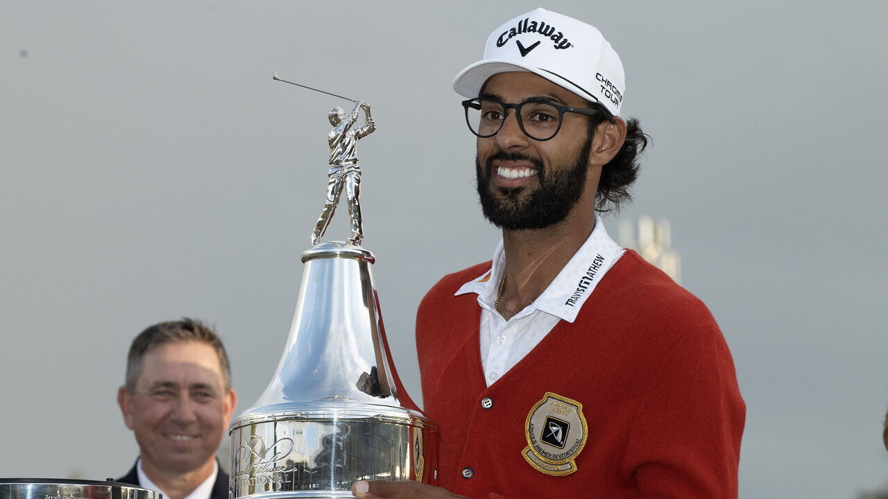 ORLANDO, FLORIDA - MARCH 08: Akshay Bhatia holds up Arnold Palmer Trophy after winning sudden-death playoff against Daniel Berger during the final round of the Arnold Palmer Invitational presented by Mastercard 2026 at Arnold Palmer Bay Hill Golf Course on March 8, 2026 in Orlando, Florida.