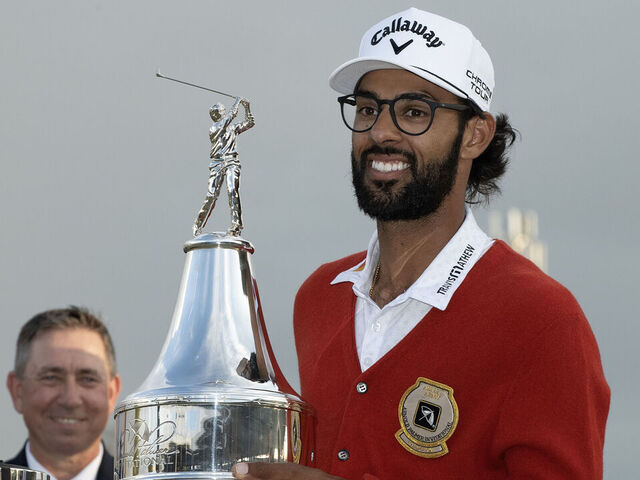 ORLANDO, FLORIDA - MARCH 08: Akshay Bhatia holds up Arnold Palmer Trophy after winning sudden-death playoff against Daniel Berger during the final round of the Arnold Palmer Invitational presented by Mastercard 2026 at Arnold Palmer Bay Hill Golf Course on March 8, 2026 in Orlando, Florida.