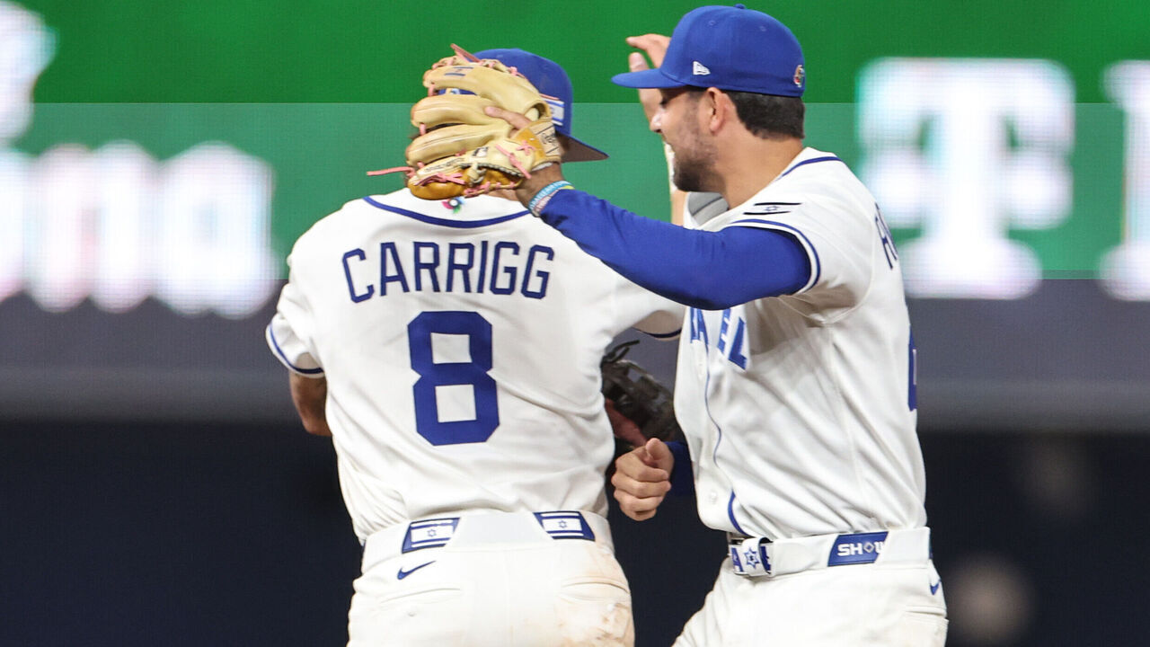 MIAMI, FLORIDA - MARCH 08: Benjamin Rosengard #22 of the Israel and Cole Carrigg #8 celebrate defeating Nicaragua 5-0 at loanDepot park on March 08, 2026 in Miami, Florida.