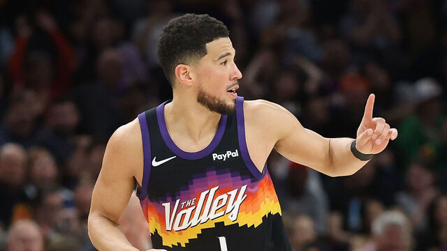 PHOENIX, ARIZONA - MARCH 08: Devin Booker #1 of the Phoenix Suns reacts after scoring against the Charlotte Hornets during the second half of the NBA game at Mortgage Matchup Center on March 08, 2026 in Phoenix, Arizona. The Suns defeated the Hornets 111-99.