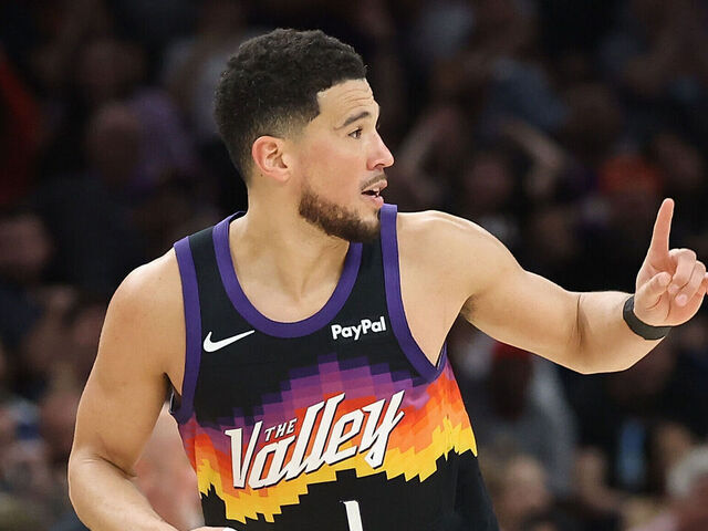 PHOENIX, ARIZONA - MARCH 08: Devin Booker #1 of the Phoenix Suns reacts after scoring against the Charlotte Hornets during the second half of the NBA game at Mortgage Matchup Center on March 08, 2026 in Phoenix, Arizona. The Suns defeated the Hornets 111-99.