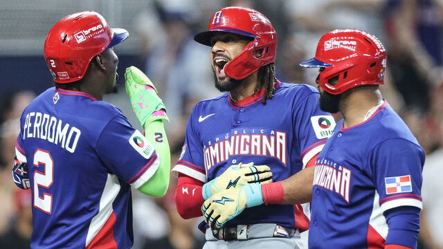 MIAMI, FLORIDA - MARCH 09: Fernando Tatis Jr. #23 of the Dominican Republic reacts with Geraldo Perdomo #2 after hitting a grand slam during the second inning against Israel at loanDepot park on March 09, 2026 in Miami, Florida.