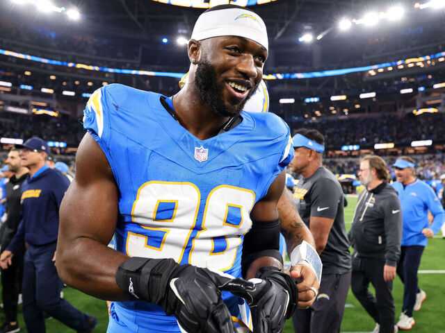 INGLEWOOD, CALIFORNIA - DECEMBER 8: Odafe Oweh #98 of the Los Angeles Chargers celebrates after winning the game against the Philadelphia Eagles at SoFi Stadium on December 8, 2025 in Inglewood, California.